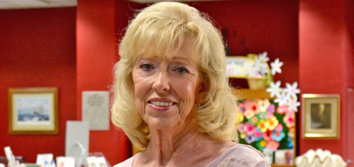 Carolyn Macha stands inside library