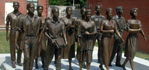 Statues showing high school students during segregation