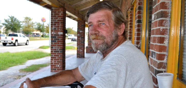 Fred Roach sits outside restaurant