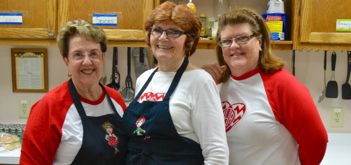 Hattie Surles and two friends in the kitchen