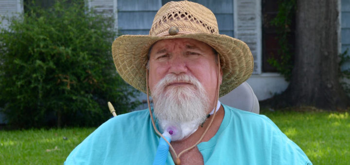 Herbert Head sits in his electric cart