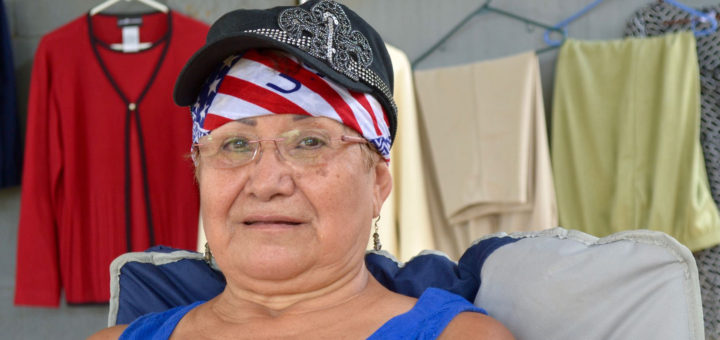 Irma Barrientes sitting in her garage