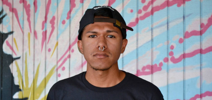 Jose Martinez in front of mural