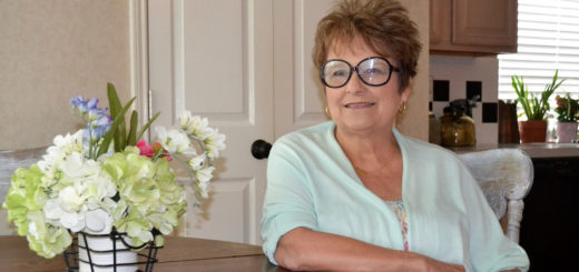 Kaye Forrester Sneed sits at table