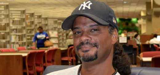 Kurt Grevenberg sits in the library