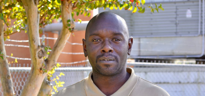 Larry Austin stands in Lee College parking lot