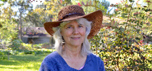 Lori Janick stands in her yard