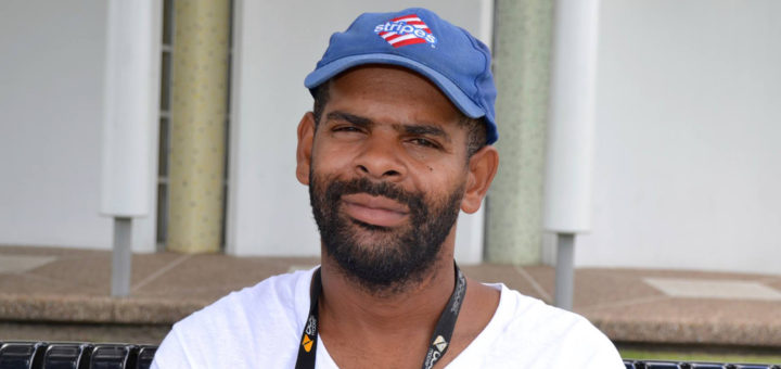 Parkoe Bailey sits outside the library
