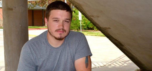 Patrick Burgess sitting at a bench