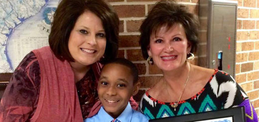 Paula Groberg with a teacher and student