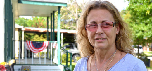 Sandra Campbell stands outside her house