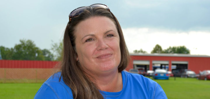 Teresa Rising sits outside