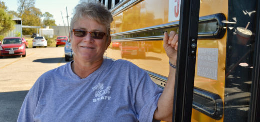 Theresa Cain holds on to school bus door