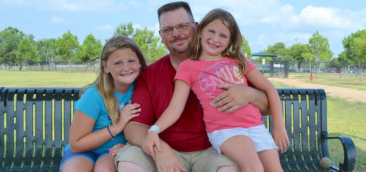 Brad Wood with two daughters at park