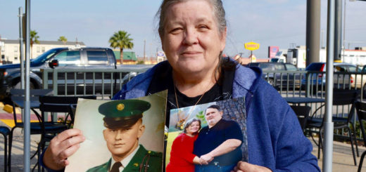 Carla Sherrod holds photos of her husband