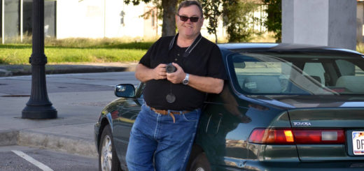 Chris Rickman holds his camera