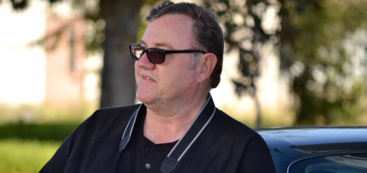 Chris Rickman holds a camera