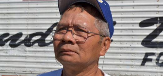 Cuong Truong stands near Purple Heart trailer