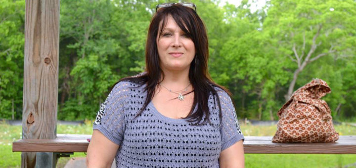 Darlene Cornick sits at picnic table