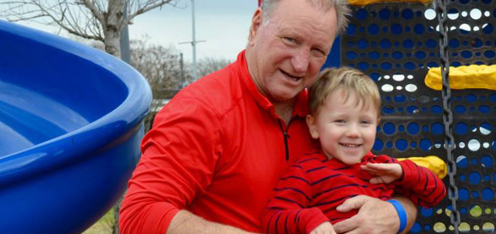 David Schexnaydre with grandson on playground