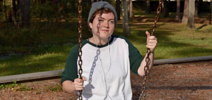 Drusilla Jennings sits in a swing