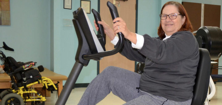 Evelyn Marlow on exercise bike