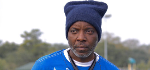 Everett Dixon wearing a hat and headphones