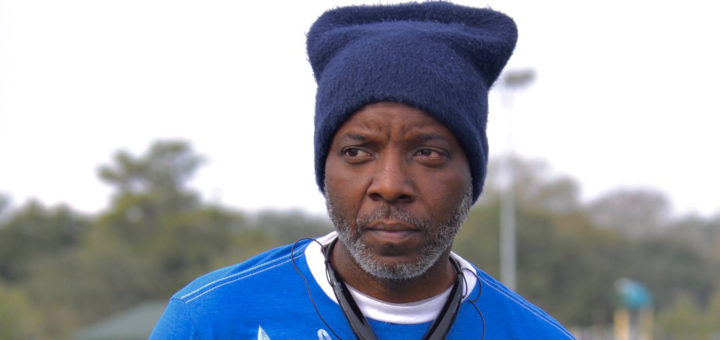 Everett Dixon wearing a hat and headphones