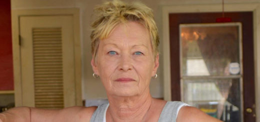 Woman stands in her garage