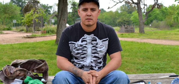 Gilbert sits on picnic table at park