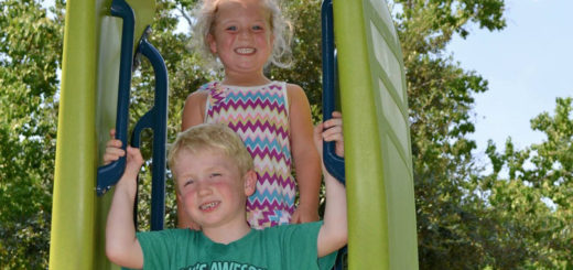 Grace and Oliver on a slide