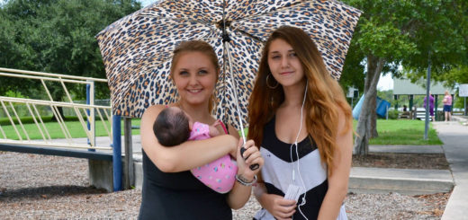 Heather and Holli Coker hold baby cousin