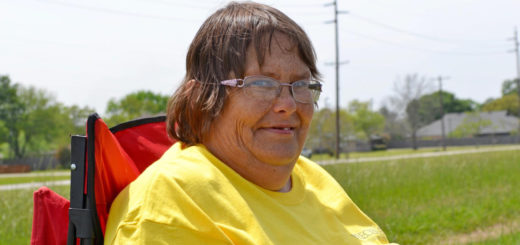 Holly Miller in a chair outside