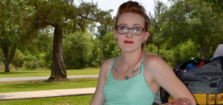 Mom sits on bench at the park