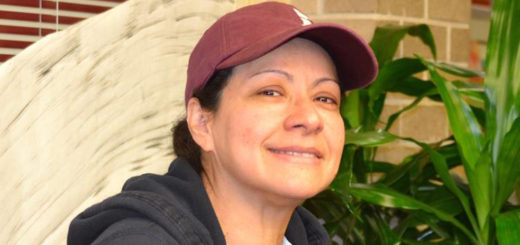 Jessenia Flores sitting in library