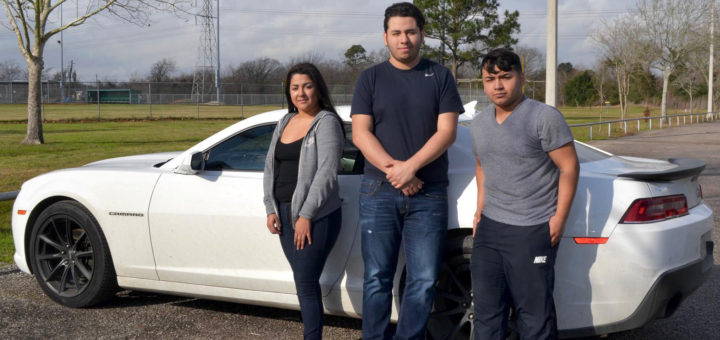Jose Garcia with cousins near his car