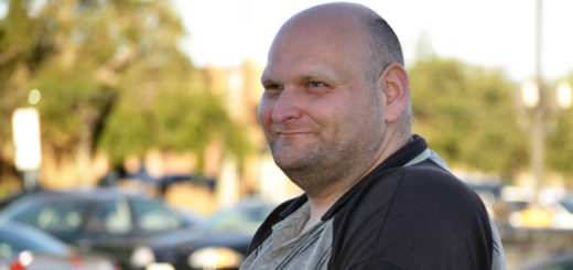 Joshua Johnson sits outside