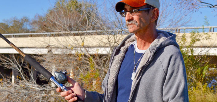 Kenneth Wayne Fulton holds fishing pole