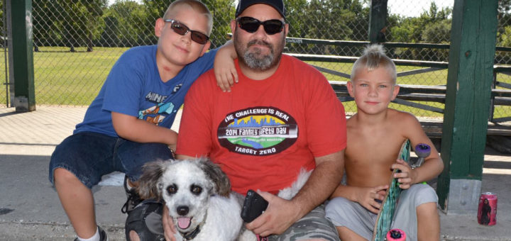 Larry Christian with two sons and dog