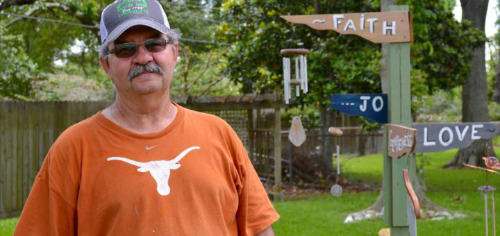 Len Jeffcoat stands in yard