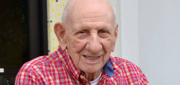 Leon McCraw sits outside library