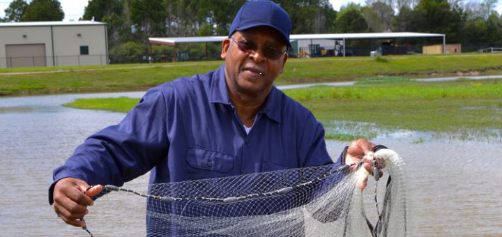Leonard Simpson holding casting net