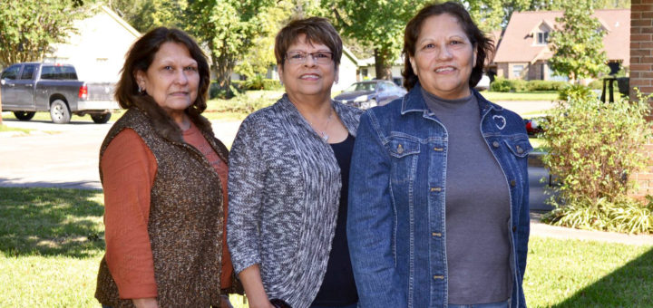 Molly Higgins and her two sisters in the yard