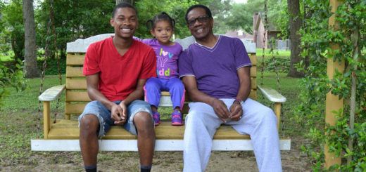 Father, son, granddaughter in a swing