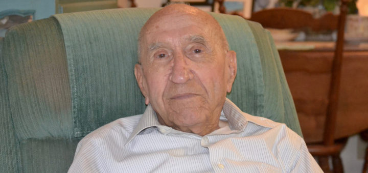 Orton Lamb sits in chair