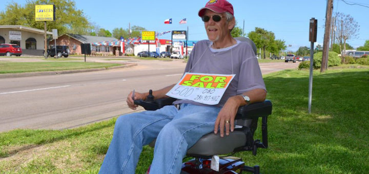 Man selling his power chair