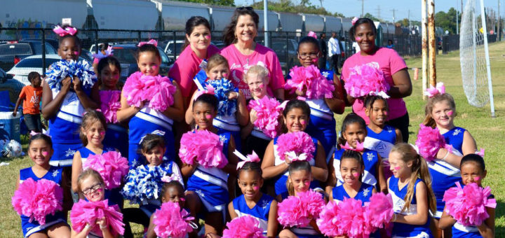 Rhonda Flock with cheerleaders