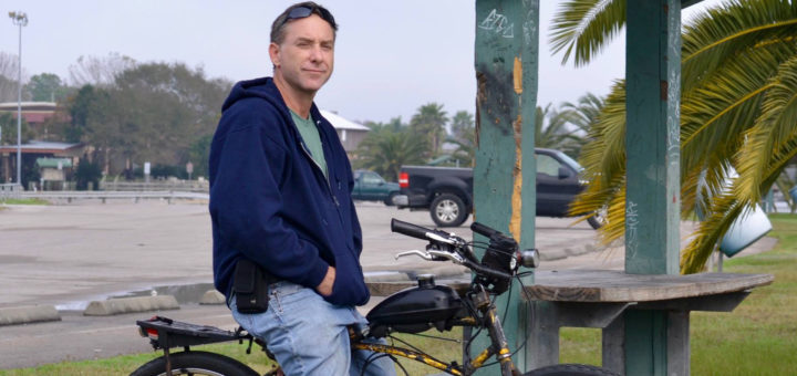 Robert Orr sits on his bike