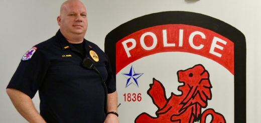 Roger Park standing in police station