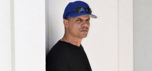 Senior stands outside library